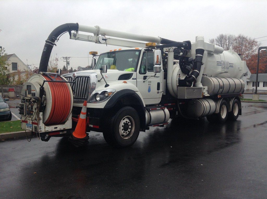 Sewer line service truck with vacuum and jetting equipment in Cerritos